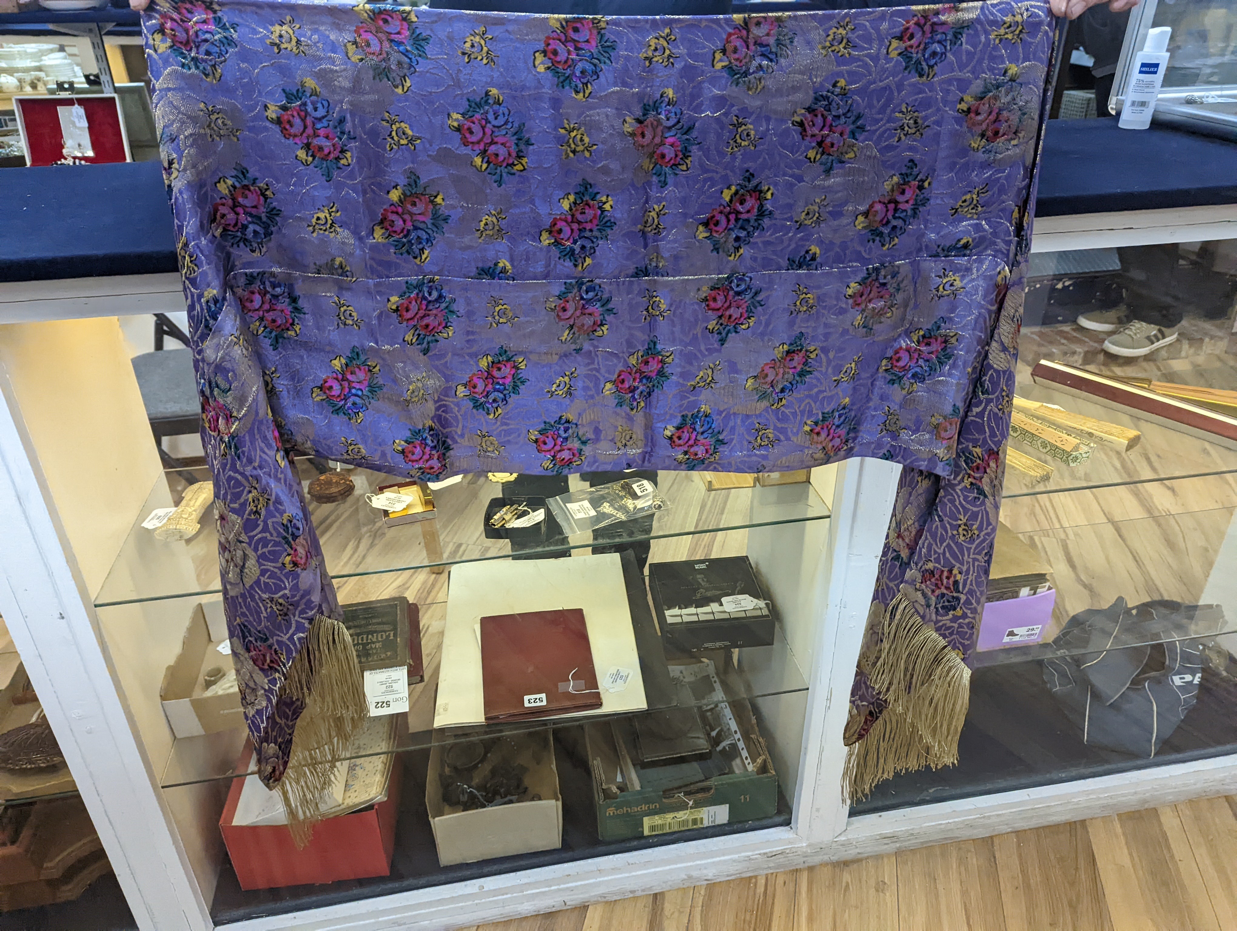 A 19th century silk woven shawl, a 1930's cut velvet shawl, a printed crepe de chine shawl, a black and gold lurex shawl and a multicoloured lurex stole (5)
